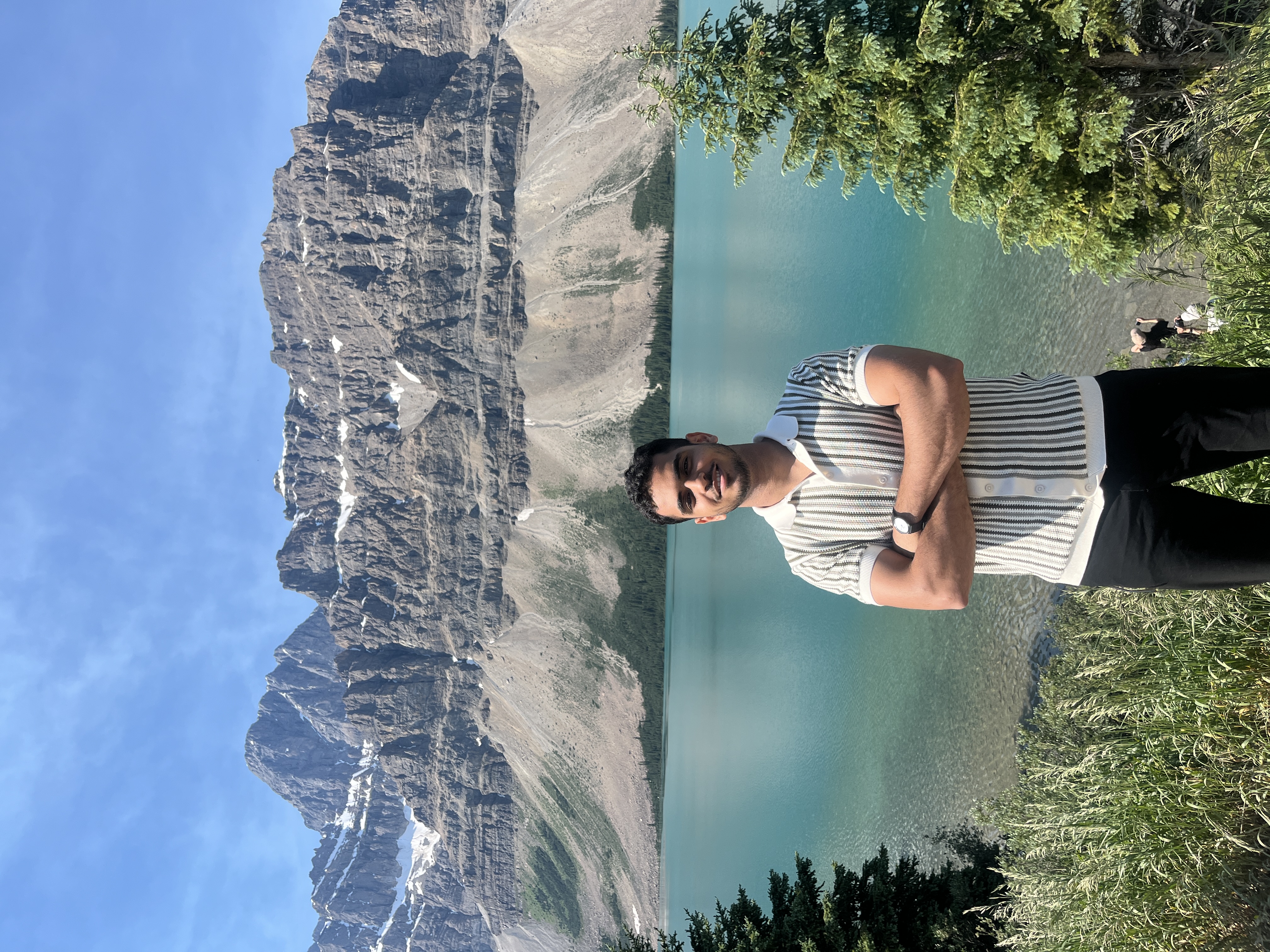 Bow Lake shoreline wide panorama with rocky foreground