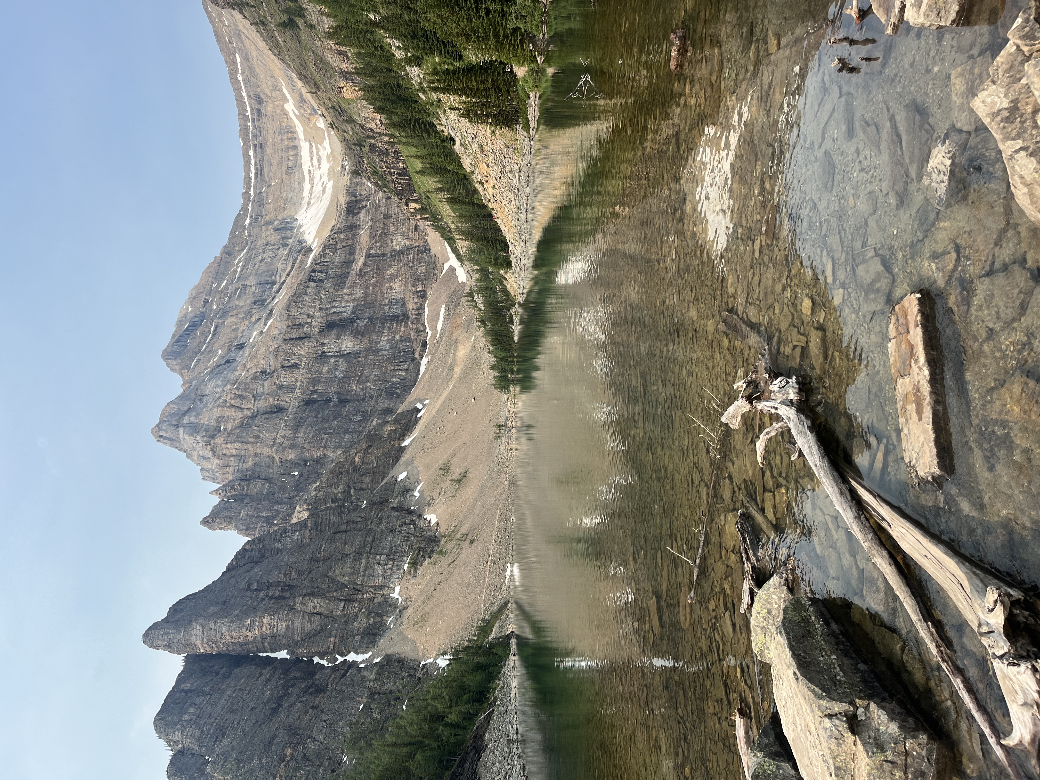 Lake Agnes calm water and mountain walls