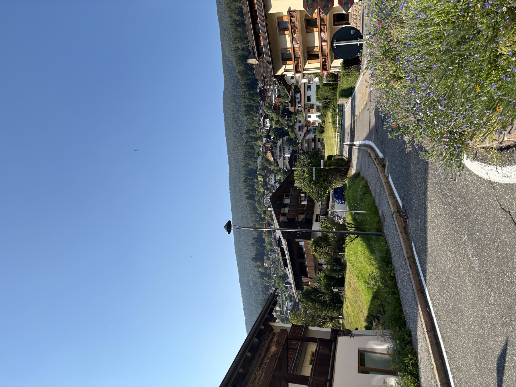 Flower-lined bridge in Ortisei village