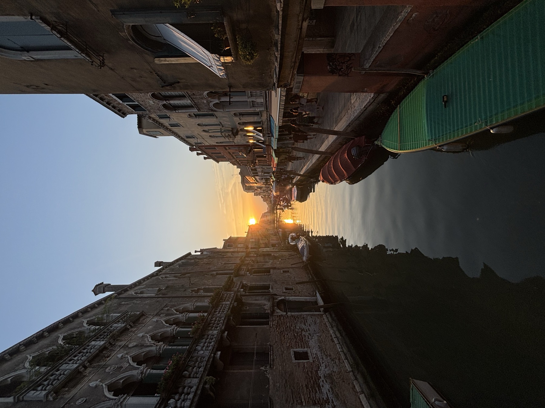 Venice canal at night with reflected lights