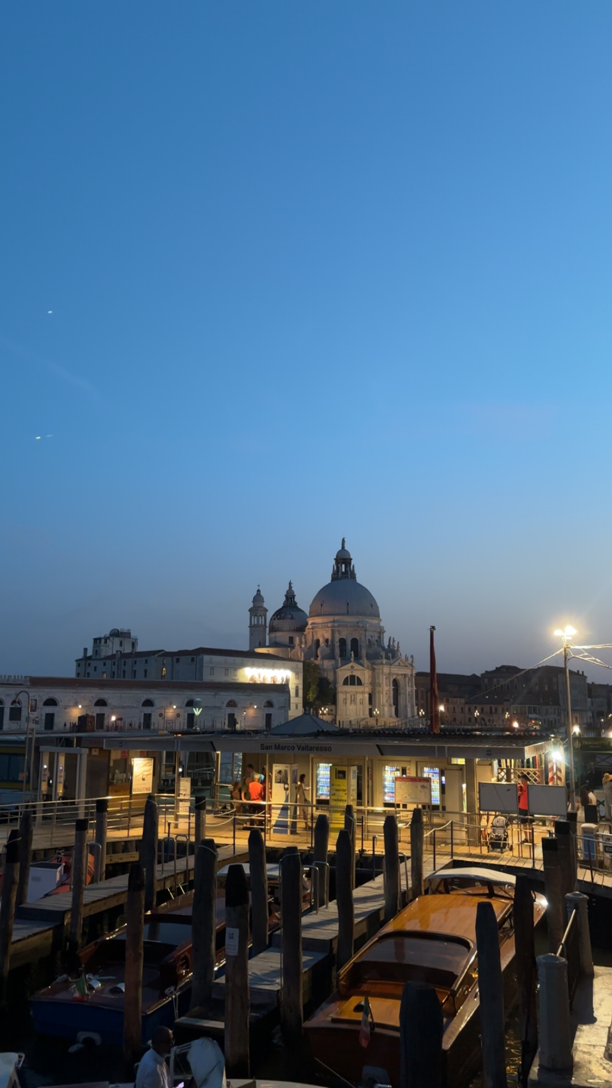 Venice canal at sunset with warm light on the water